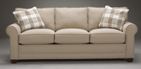 Beige sofa with decorative pillows
